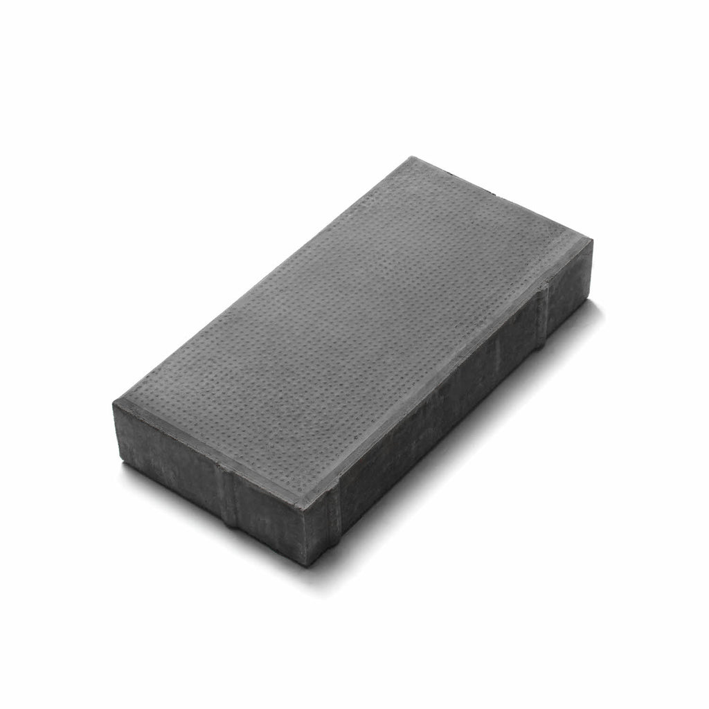 Frilagd Superplattan i färgen Svart med en elegant struktur som ger ett exklusivt intryck på gångar och torg. Tillverkad av S:T Eriks. Stengrossen säljer produkten.